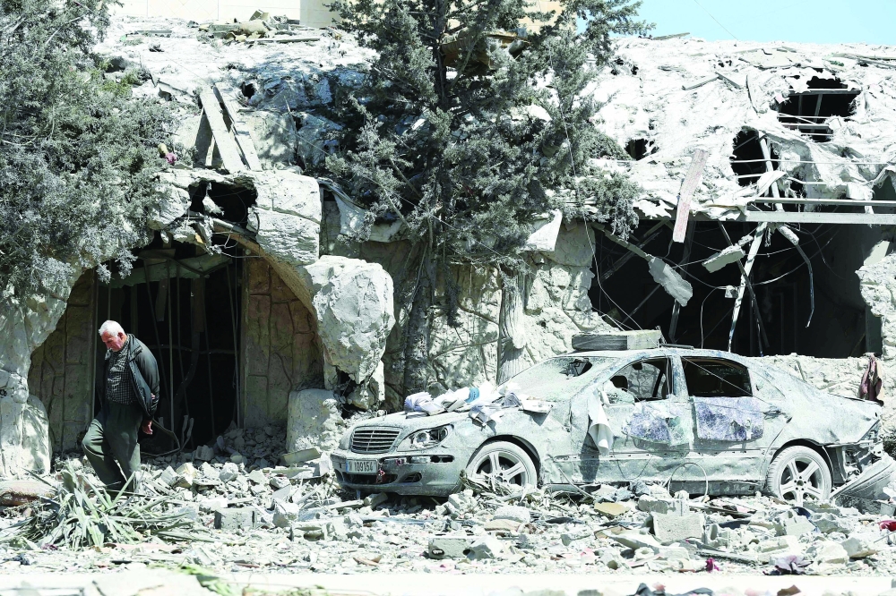 A man checks the site of an Israeli air strike that targeted a religious complex the day before in the southern Lebanese coastal city of Sidon. — AFP