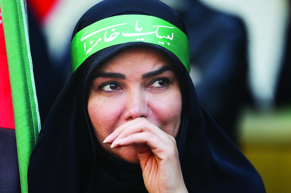 An Iranian woman attends a ceremony marking 40 days since the late Supreme Leader of Iran, Ayatollah Ali Khamenei, was killed in Israeli and US strikes, in Tehran, Iran, on Thursday. — Reuters