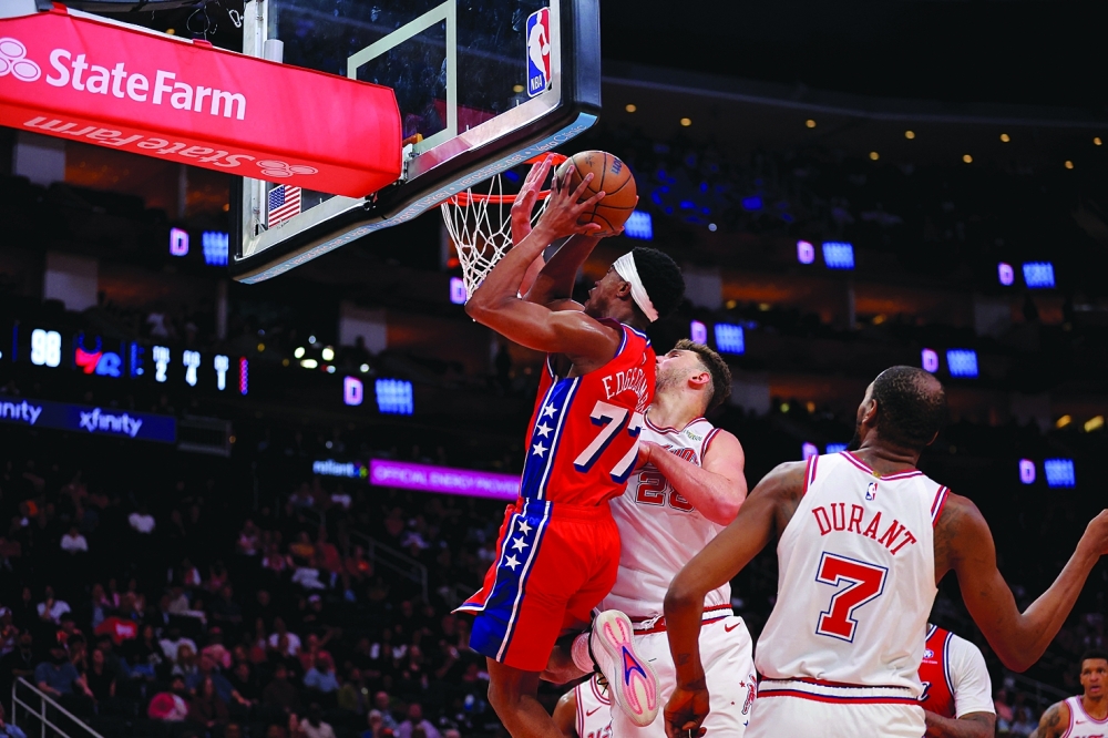 Philadelphia 76ers' VJ Edgecombe (77) shoots the ball against Houston Rockets' Alperen Sengun (28) at Toyota Center. — Imagn Images