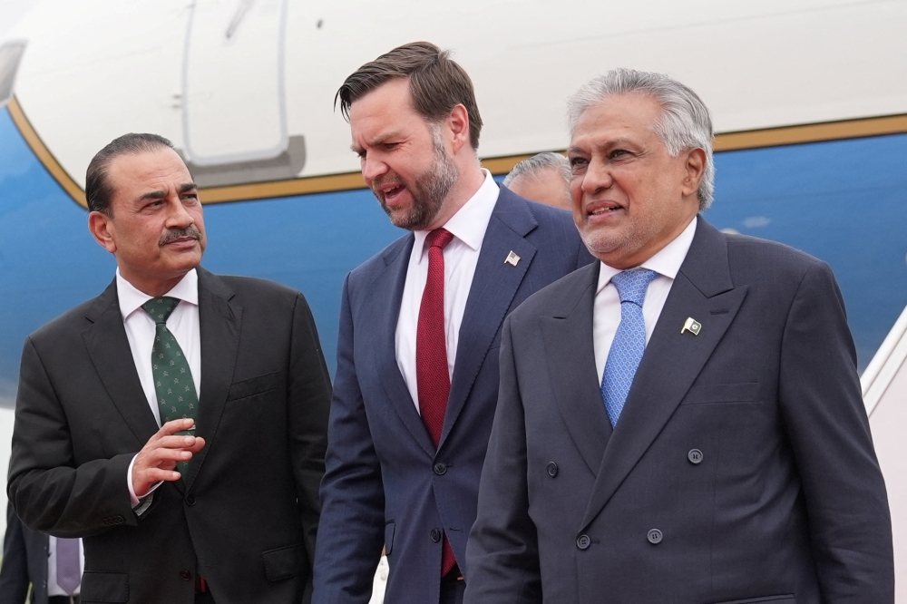 U.S. Vice President JD Vance talks with Pakistan's Chief of Defence Forces and Chief of Army Staff Field Marshal Asim Munir and Pakistani Deputy Prime Minister and Foreign Minister Mohammad Ishaq Dar after arriving for talks with Iranian officials in Islamabad, Pakistan, Saturday, April 11, 2026.   