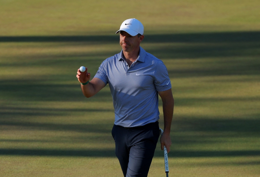   Northern Ireland's Rory McIlroy reacts after holing a birdie putt on the 15th hole during the third round  