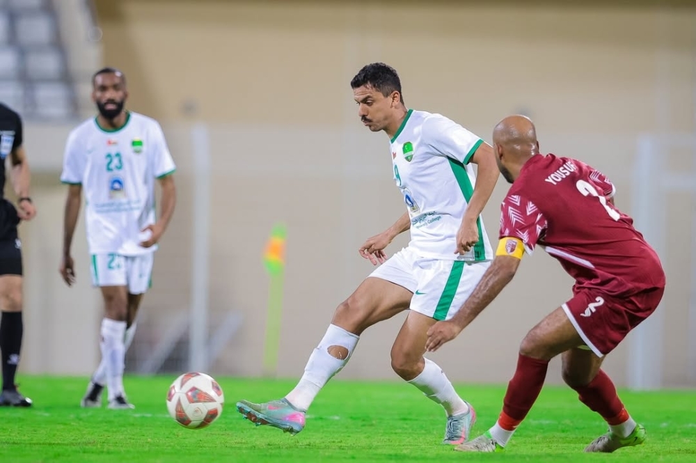 Action from the Jindal League match between Al Nahda in white and Al Rustaq in red.