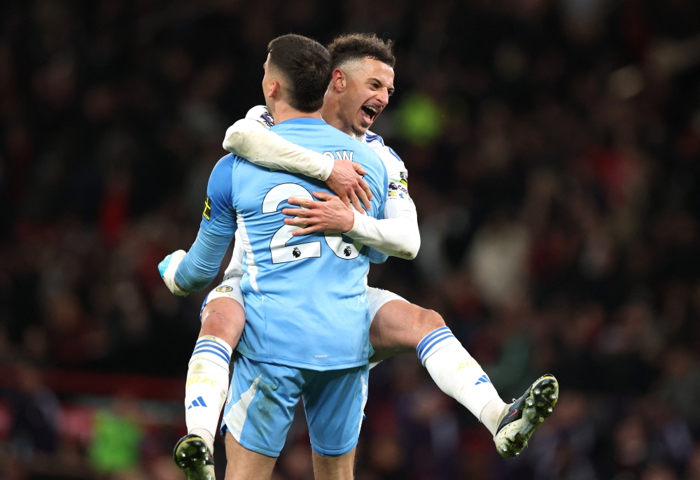   Leeds United's Karl Darlow celebrates with Ethan Ampadu after the match  
