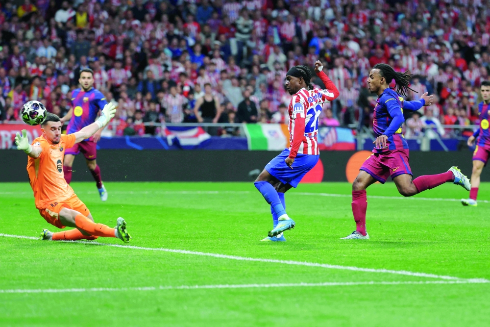 Atletico Madrid's English forward #22 Ademola Lookman scores his team's first goal during the Uefa Champions League quarterfinal second leg match against FC Barcelona at Metropolitano Stadium in Madrid. — AFP