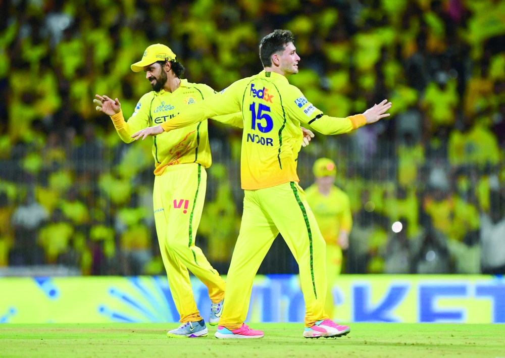 Chennai Super Kings' Noor Ahmad celebrates the wicket of Kolkata Knight Riders' Rinku Singh with Ruturaj Gaikwad. — Reuters