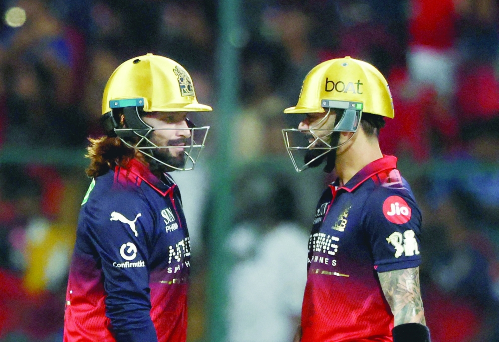 Royal Challengers Bengaluru's Virat Kohli and Rajat Patidar during the IPL match against Lucknow Super Giants. — Reuters