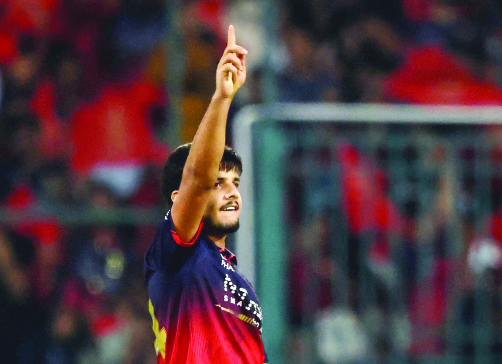 Royal Challengers Bengaluru's Rasikh Salam celebrates taking the wicket of Lucknow Super Giants' Mukul Choudhary. — Reuters 