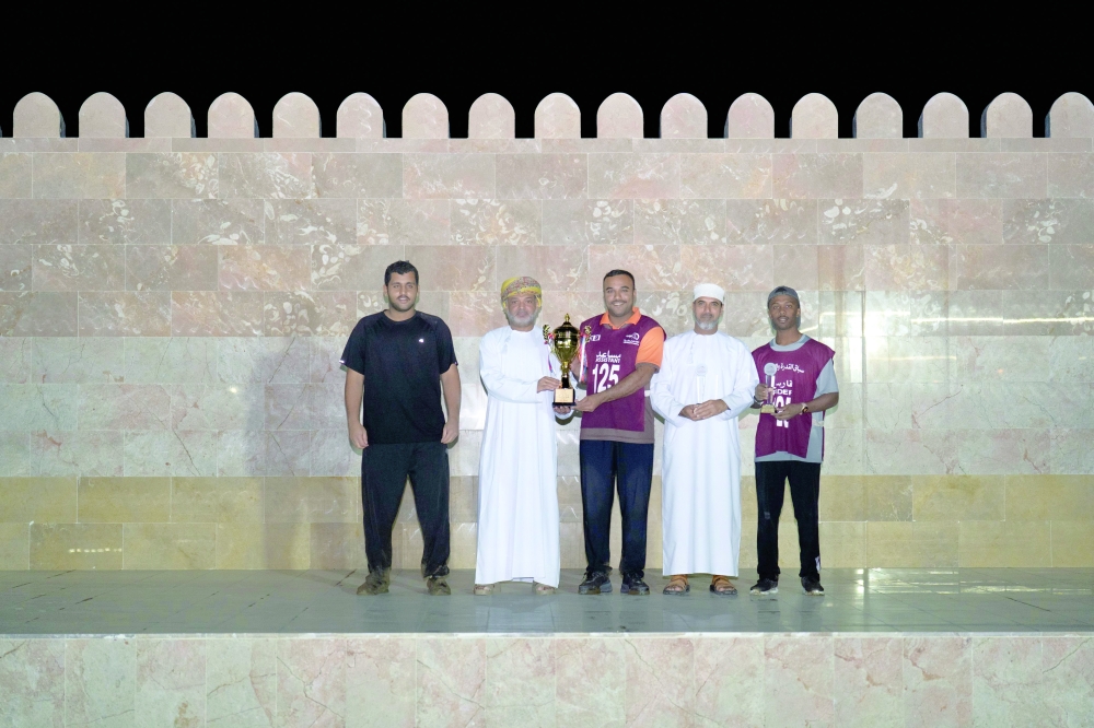 Winners receive their trophies.