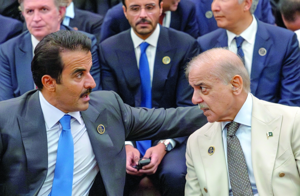 Qatar's Emir Tamim bin Hamad al Thani and Pakistan's Prime Minister Shehbaz Sharif at the Antalya Diplomacy Forum in Antalya, Türkiye. — Reuters