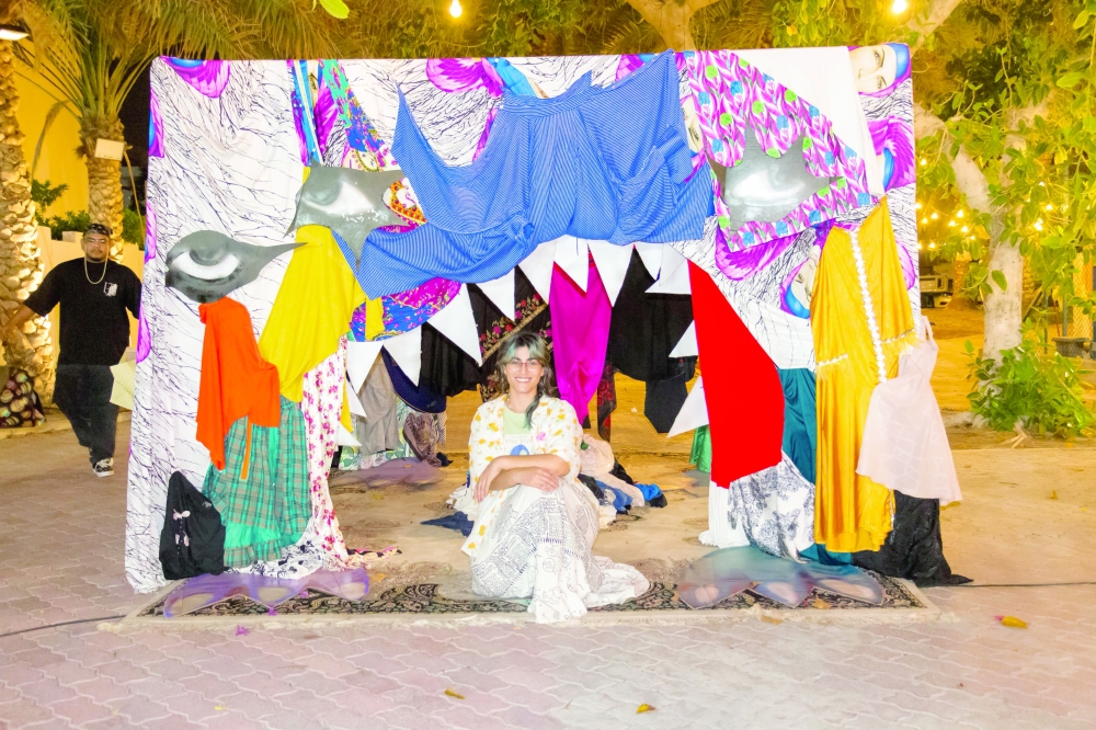 Artist Shahad al Hamdi in front of her art installation