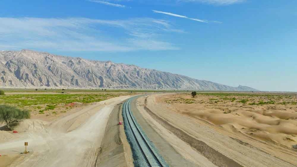 The railway cuts through urban and industrial areas, mountainous terrain and deep valleys. — ONA