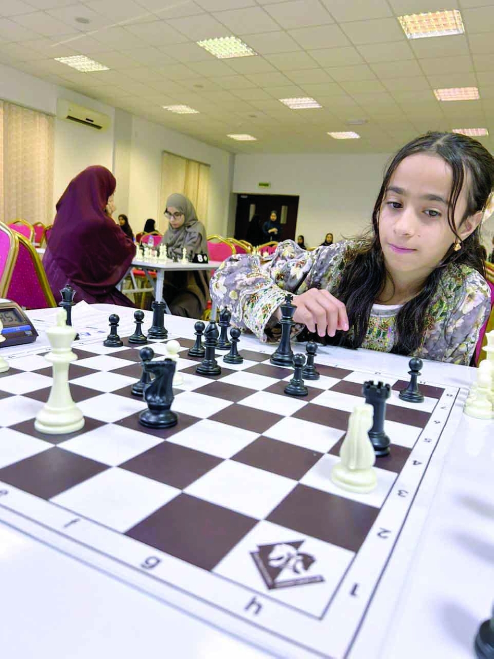 A player makes a move during the opening round.