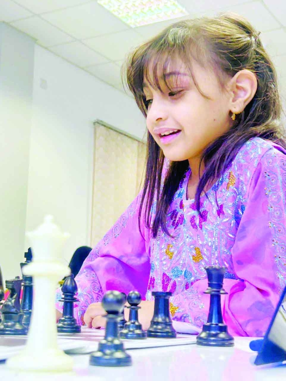 A player makes a move during the opening round.