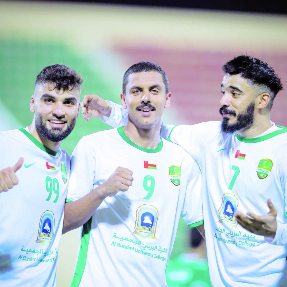 Al Nahda's Mohammed al Ghafri celebrates with teammates after scoring the second goal.