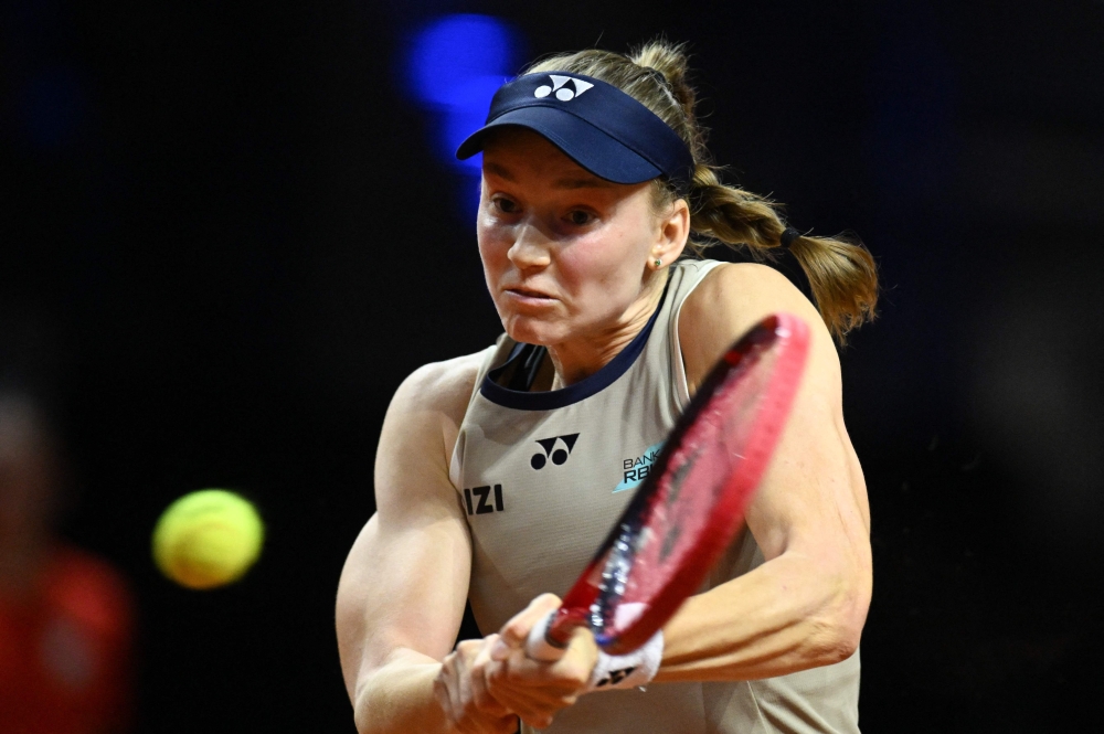 Kazakhstan Elena Rybakina returns the ball to Russia Mirra Andreeva (not in picture) during their semifinal match  
