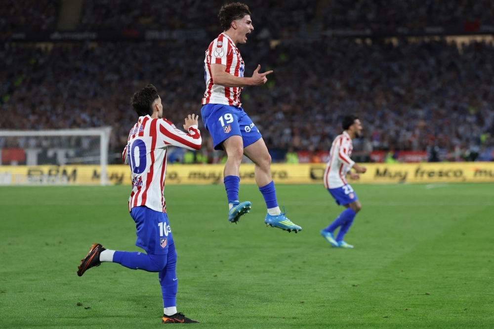 Atletico Madrid's Argentine forward #19 Julian Alvarez celebrates scoring his team's second goal during the Copa del Rey (King's Cup) final  