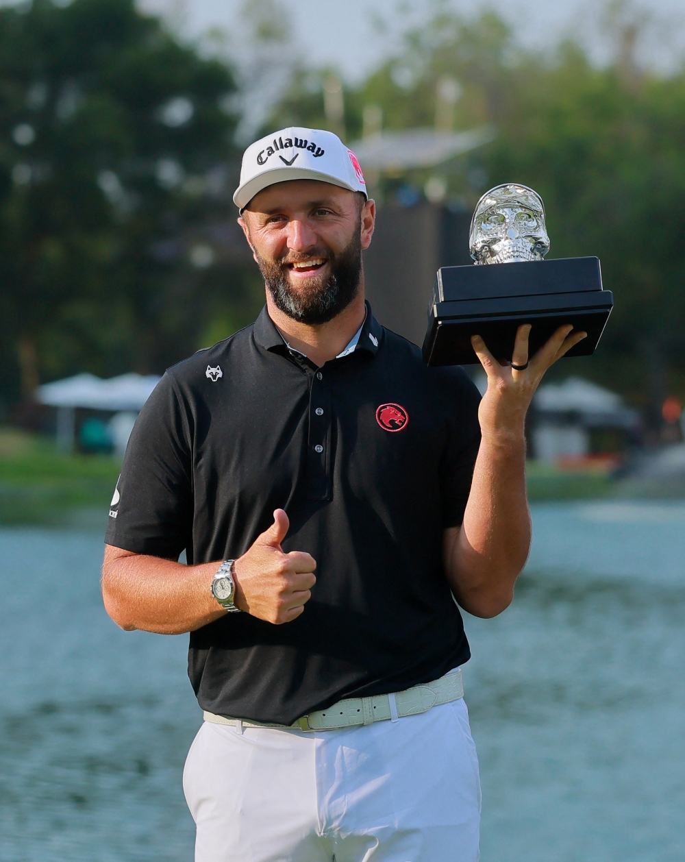   Legion XIII's Jon Rahm celebrates with the LIV Golf Mexico City trophy 