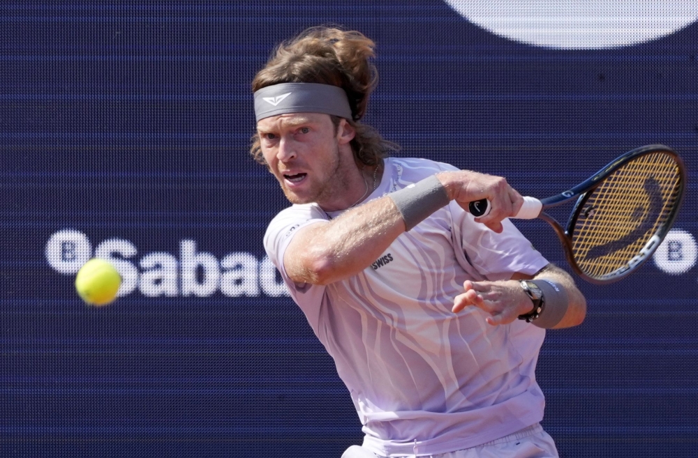 Russia's Andrey Rublev returns the ball against France's Arthur Fils during their men singles final match  