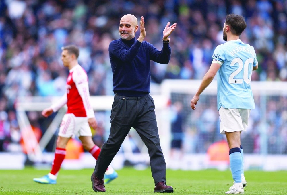 Manchester City manager Pep Guardiola celebrates after the match Action Images. — Reuters