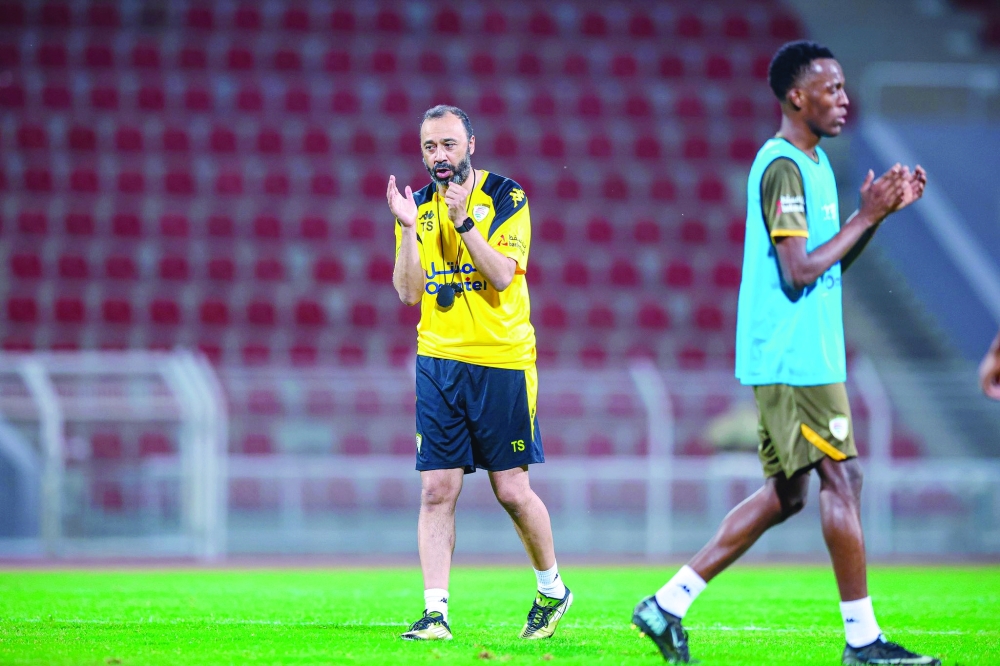 A photo of the new coach, Tarik Sektioui, being encouraged at the training camp.