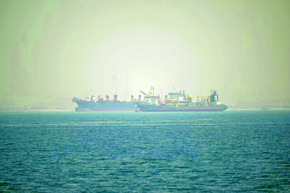 Commercial vessels are seen off the coast of Dubai. — AFP