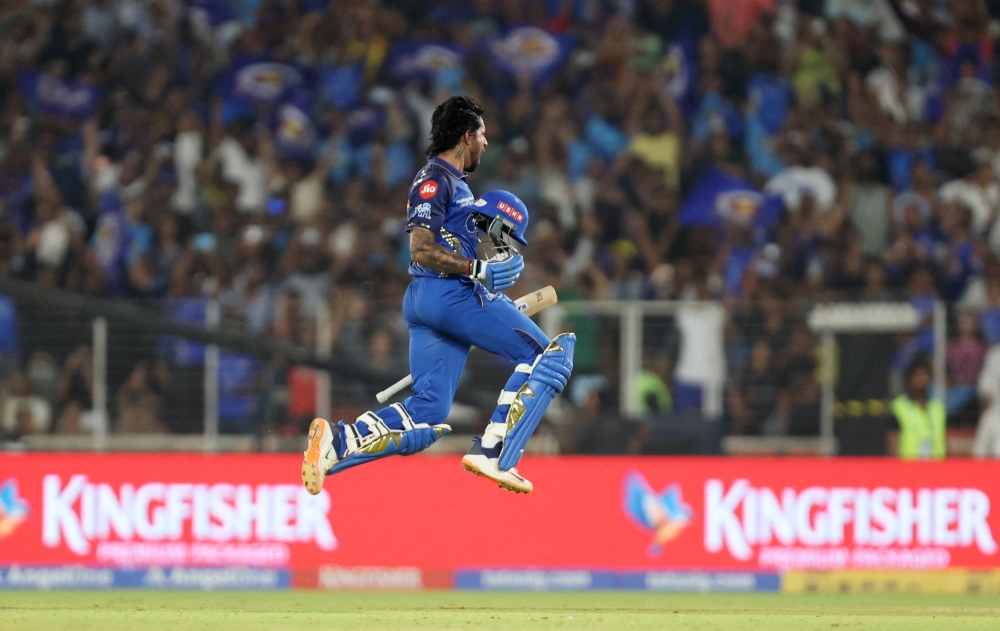    Mumbai Indians' Tilak Varma celebrates after reaching his century  