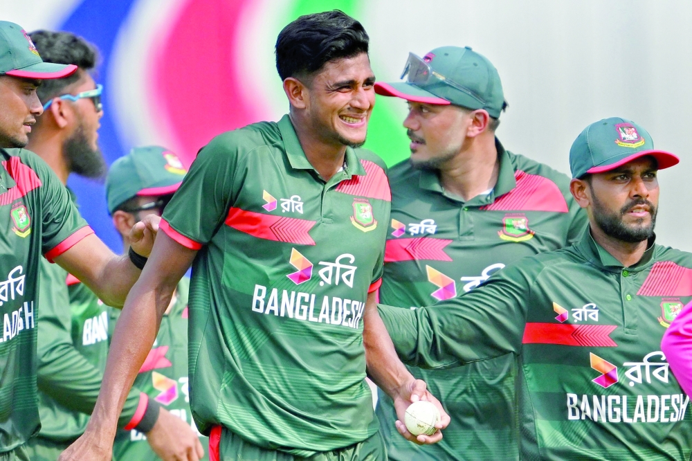Bangladesh's Nahid Rana (C) celebrates a five-wicket haul with teammates after taking the wicket of New Zealand's Jayden Lennox at Sher-e-Bangla National Stadium in Mirpur. — AFP
