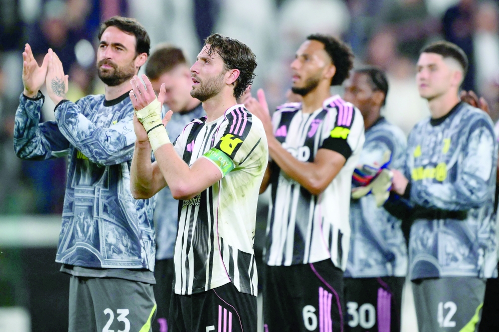 Juventus' Italian midfielder #05 Manuel Locatelli and teammates greet supporters after their Italian Serie A match against Bologna at the Allianz stadium in Turin. — AFP