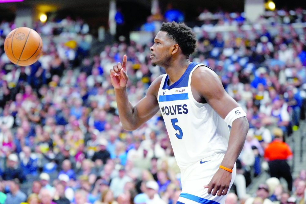 Minnesota Timberwolves' Anthony Edwards (5) calls for a replay against the Denver Nuggets during game two of the first round of the 2026 NBA Playoffs at Ball Arena. — Imagn Images