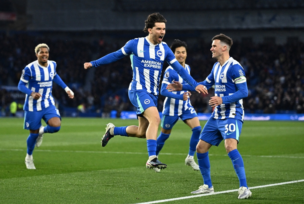  Brighton & Hove Albion's Ferdi Kadioglu celebrates scoring their first goal with Pascal Gross  