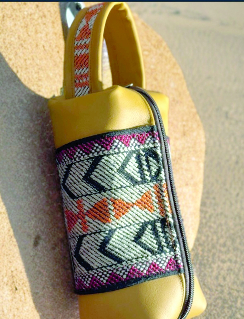 The designer creates unique handmade leather bags.