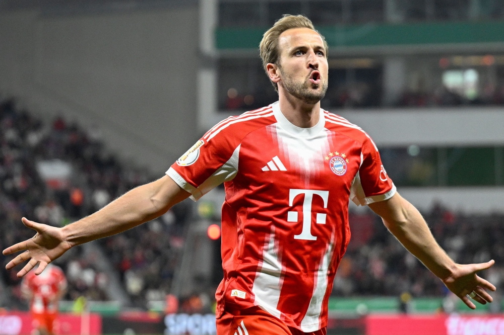 Bayern Munich's English forward #09 Harry Kane celebrates scoring the opening goal during the German Cup (DFB-Pokal) semi-final