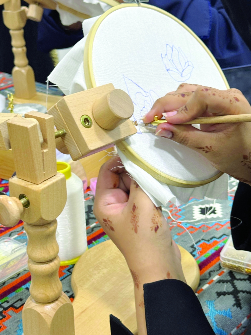 Heba aims to empower women by helping them take on multiple roles: as creative designers, skilled seamstresses, and future entrepreneurs.