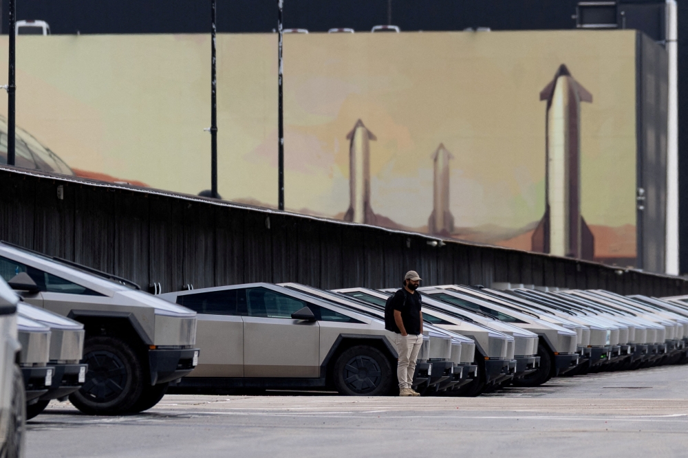 Tesla Cybertrucks are parked outside of a SpaceX installation as the company . REUTERS