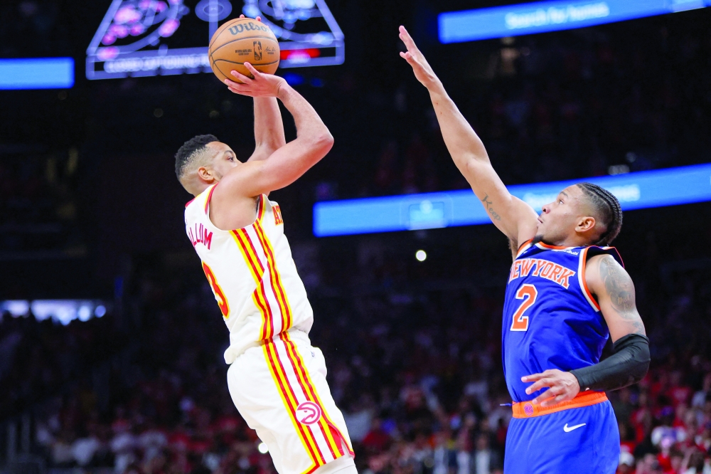 Atlanta Hawks' CJ McCollum (3) makes the go-ahead basket over New York Knicks'  Miles McBride (2) during game three of the first round of the 2026 NBA Playoffs at State Farm Arena. — Imagn Images