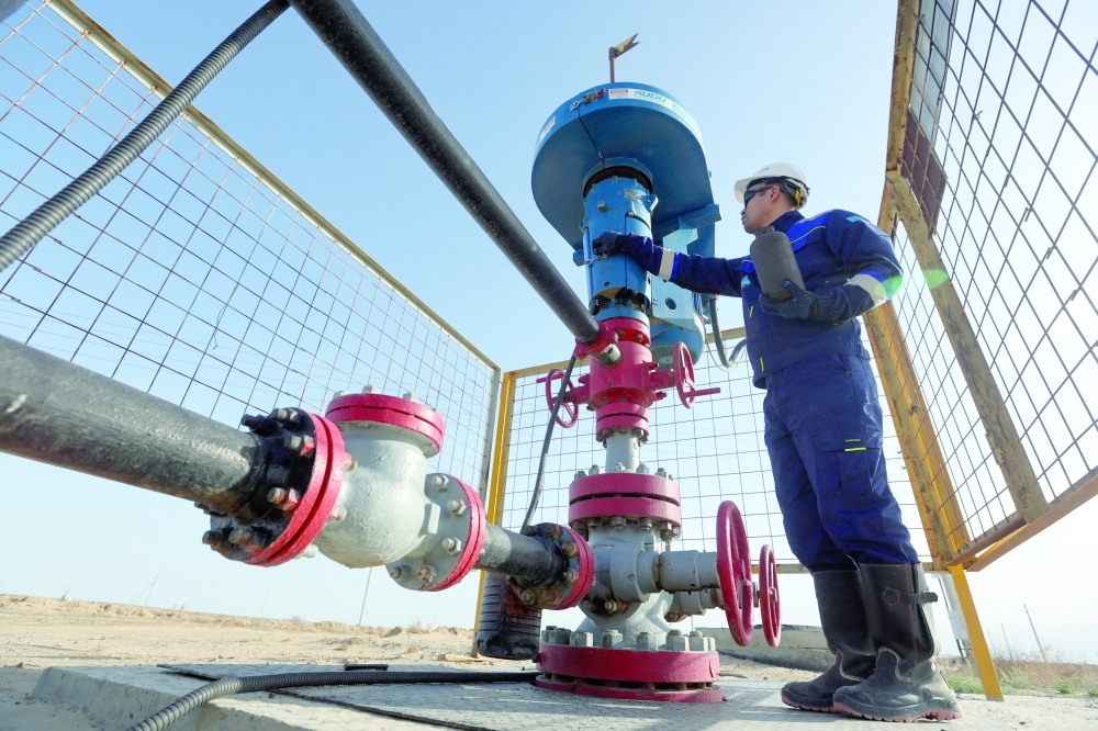 A specialist works at the Airankol oil field operated by Caspiy Neft in the Atyrau region, Kazakhstan. — Reuters