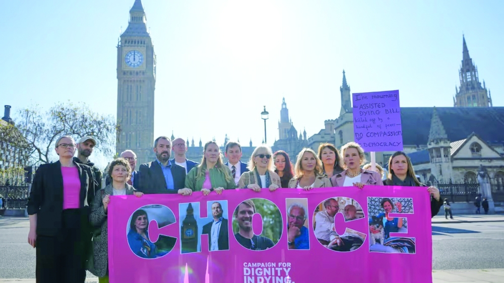 Campaigners hold a banner outside parliament in London as a proposed law to legalise assisted dying in England and Wales will run out of time on Friday, more than a year after MPs first voted in favour of it. — AFP