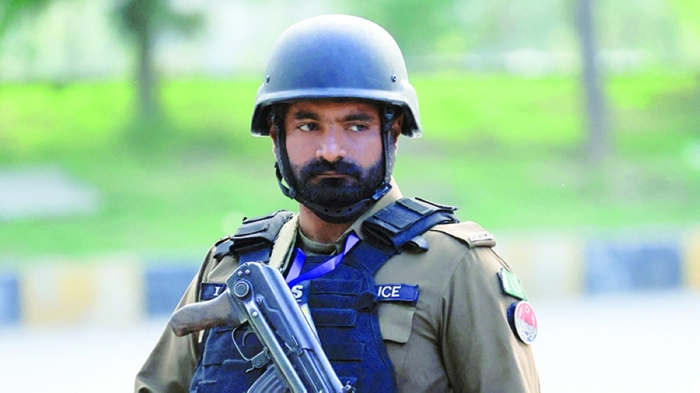 A police officer stands guard at D Chowk, near President's house, as Pakistan prepares to host the U.S. and Iran for the second phase of peace talks in Islamabad, Pakistan, April 23, 2026. REUTERS/Akhtar Soomro