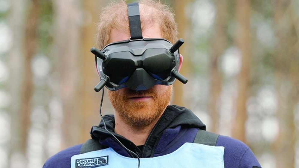 Prince Harry controls an AI-powered unmanned aerial vehicle as he visits members of the HALO Trust in Kyiv on Friday. — AFP