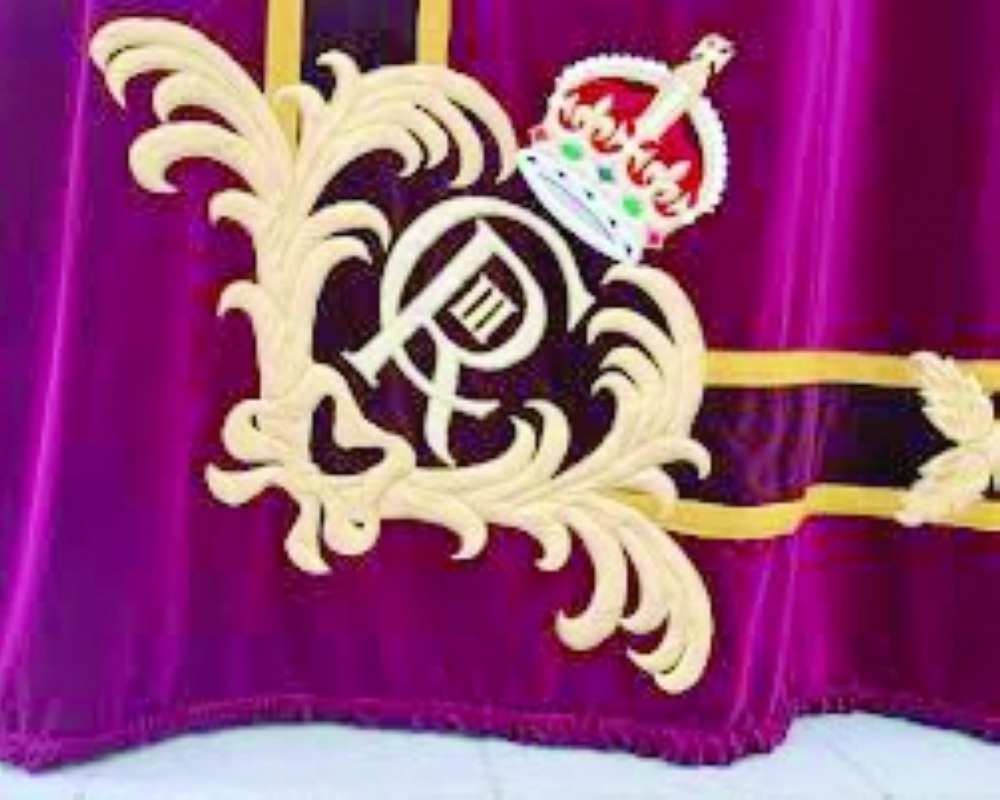 The royal cypher of Britain's King Charles is pictured on one of two parts of the new London Royal Opera House stage curtains at the Gerriets workshop in Volgelsheim. — Reuters