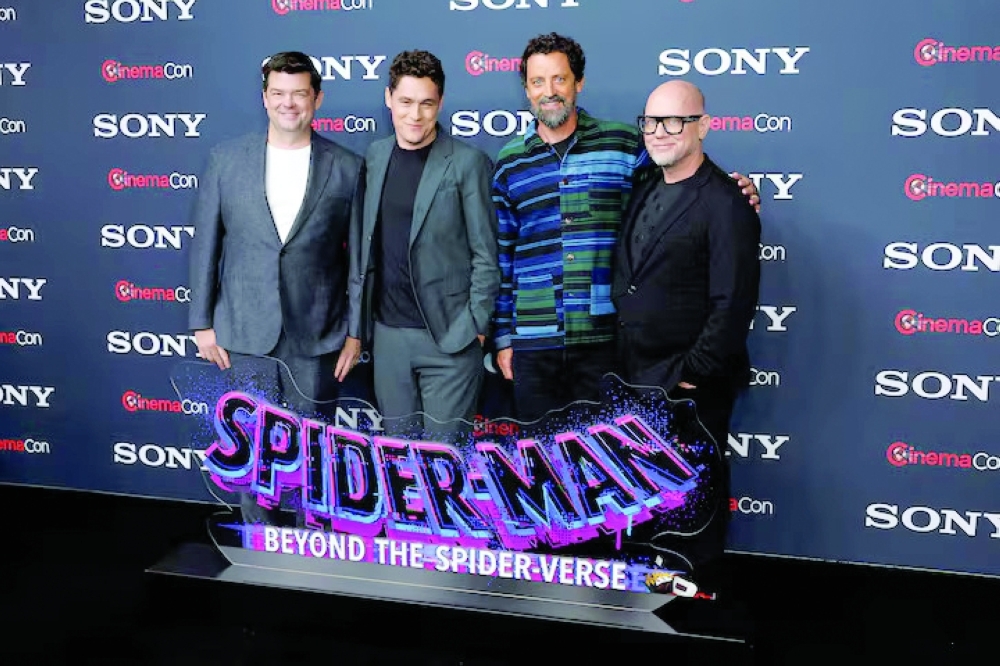 Christopher Miller, Phil Lord, Bob Persichetti and Justin K Thompson, promoting "Spider-Man: Beyond the Spider-Verse", pose before a Sony presentation at CinemaCon. — Reuters