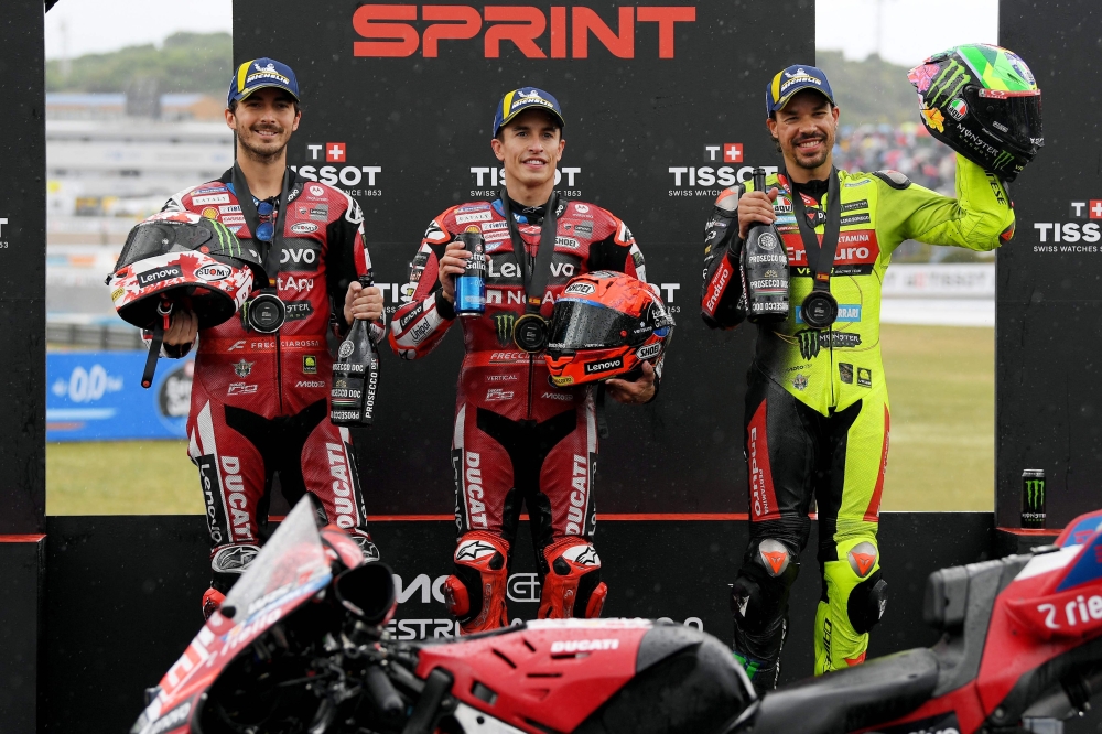 Winner Team Ducati Lenovo Team's Marc (C), second placed Team Ducati Lenovo Team's Francesco (L) and third placed Team Pertamina Enduro VR46 Racing Team's Franco 
