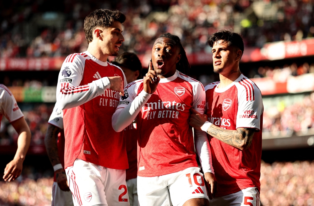  Arsenal's Eberechi Eze celebrates scoring their first goal with Piero Hincapie and Kai Havertz 