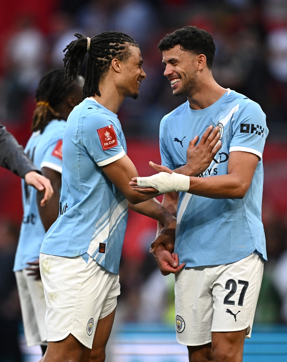 Manchester City's Nathan Ake and Matheus Nunes celebrate after the match  