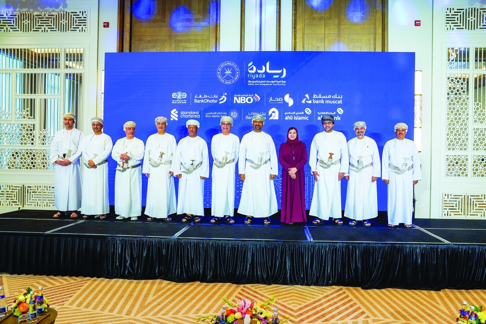 Dignitaries with CEOs of the participating banks at the signing on Sunday.