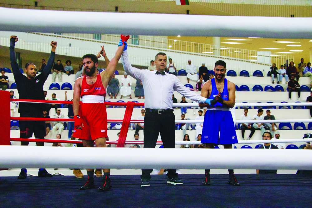 Kameel al Lawati celebrates after securing victory during the final bouts of the championship.