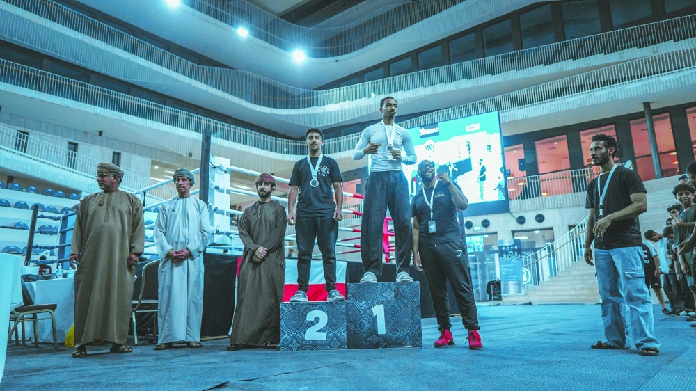 Winners and officials pose for a group photo at the conclusion of the first Oman Boxers Championship.