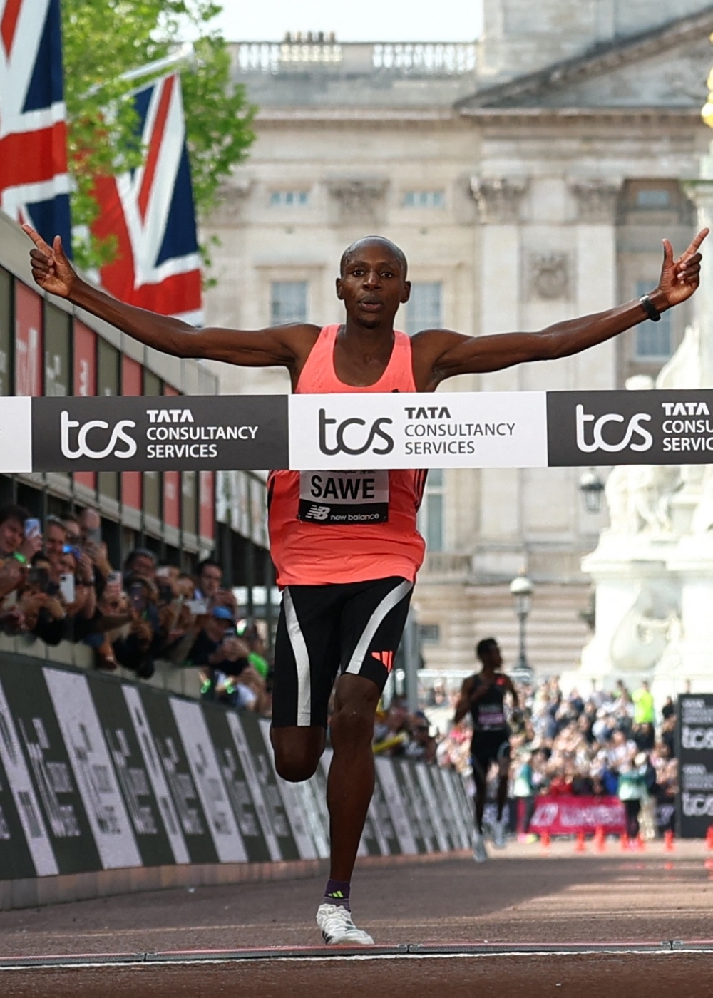   Kenya's Sabastian Sawe crosses the finish line to win the men's elite race  