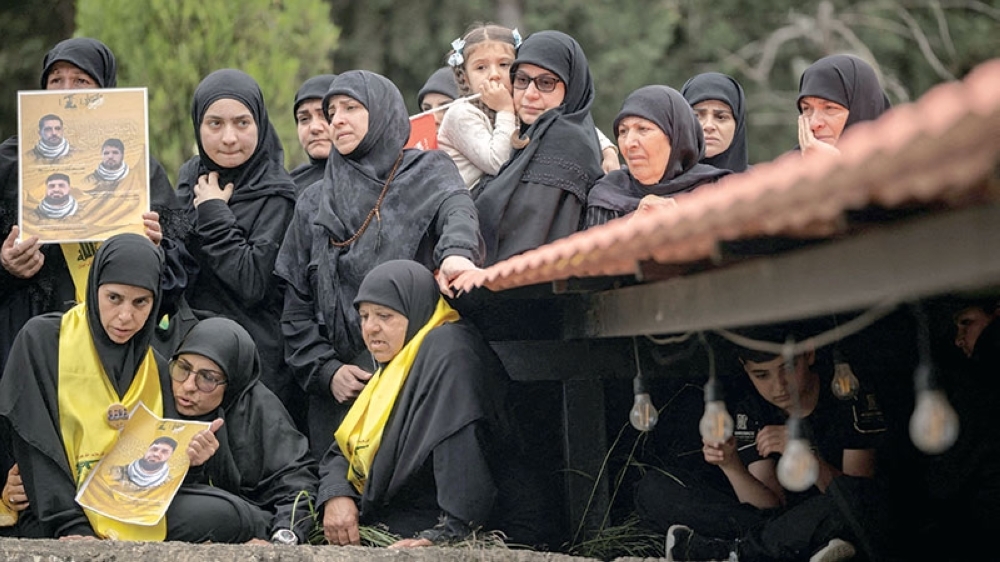 Mourners attend a funeral ceremony of four Hezbollah fighters and two civilians, in the village of Maaroub, Lebanon. — Reuters