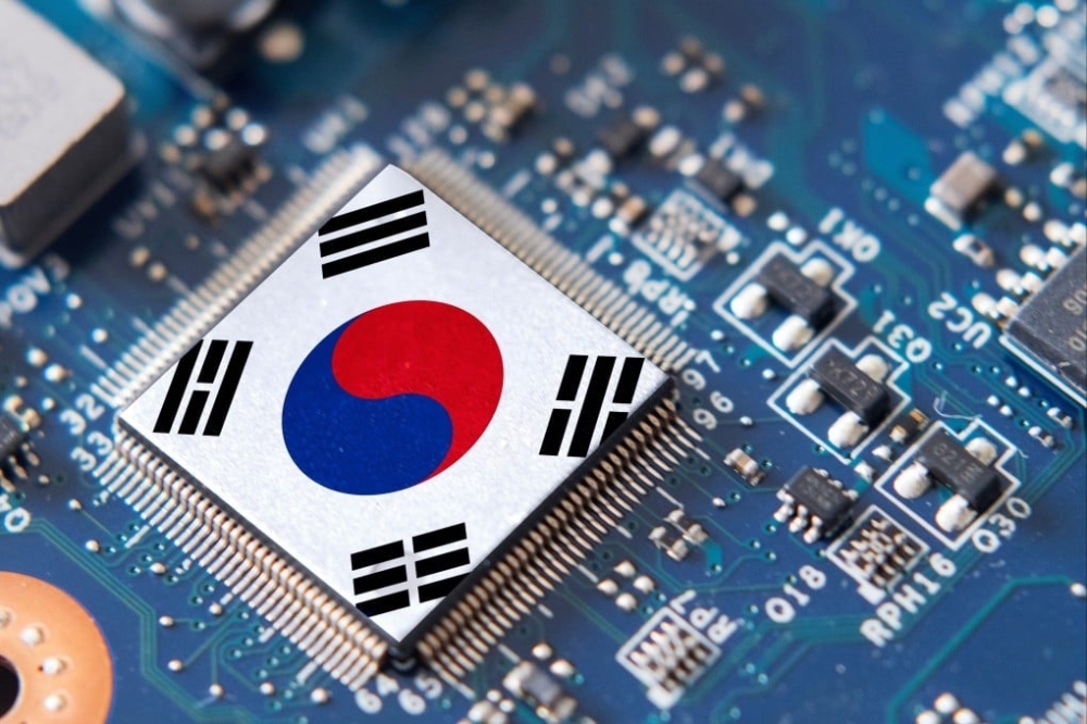 Semiconductor chips with the South Korean flag symbol are seen on a circuit board of a computer in this illustration.